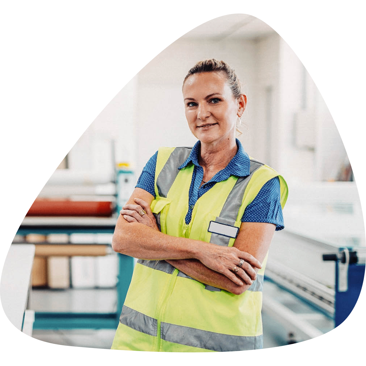 Woman wearing high vis vest standing with arms crossed
